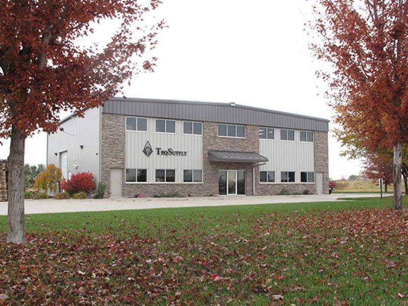 beige commercial building and trees in the fall