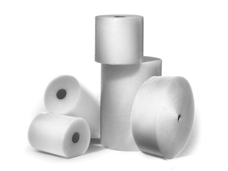several rolls of plastic packaging wrap
