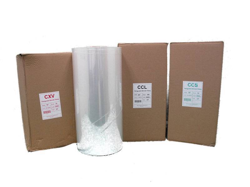 cardboard boxes and a roll of shrink wrap for packaging
